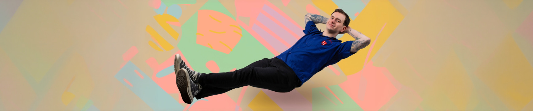 Connor Burns reclining in coloured space